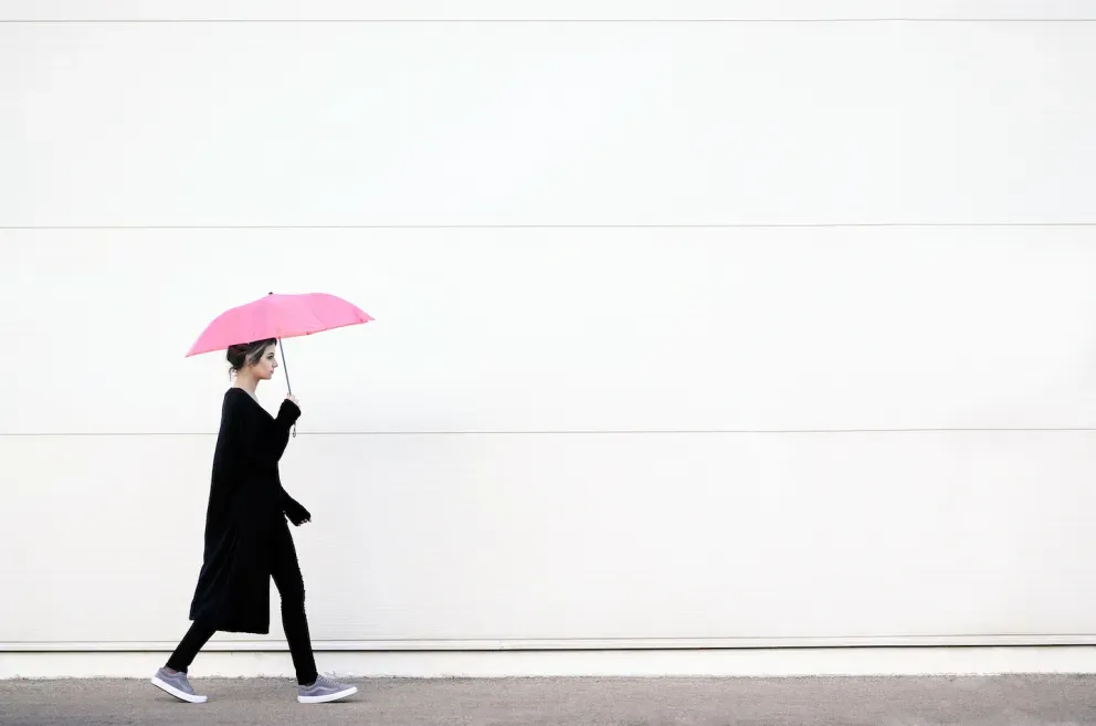 person walking with unbrella person walking with unbrella