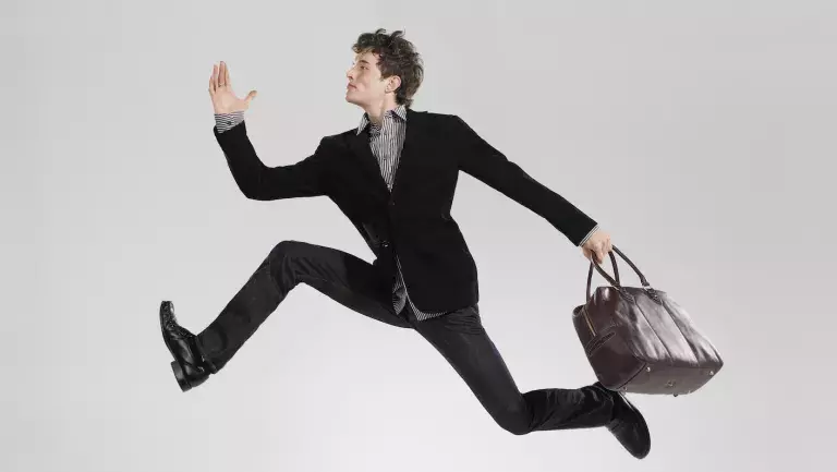 Business man leaping effortlessly