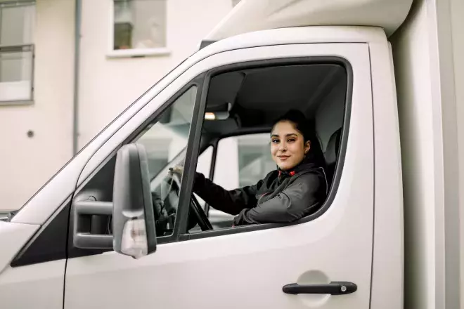 Woman driving a delivery van