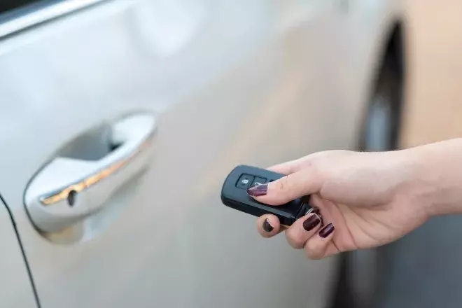 Hand holding car keys