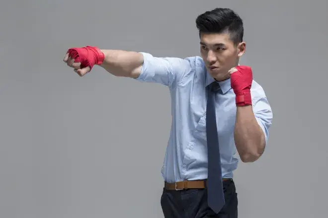 business man throwing a punch