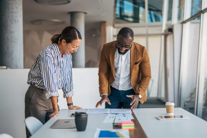 two business associates analyzing data