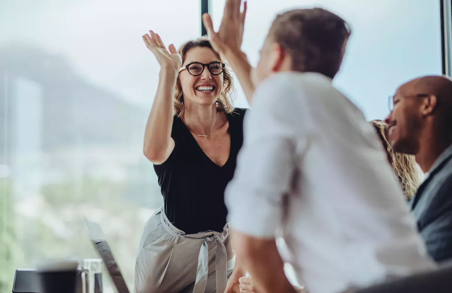 coworkers giving high five