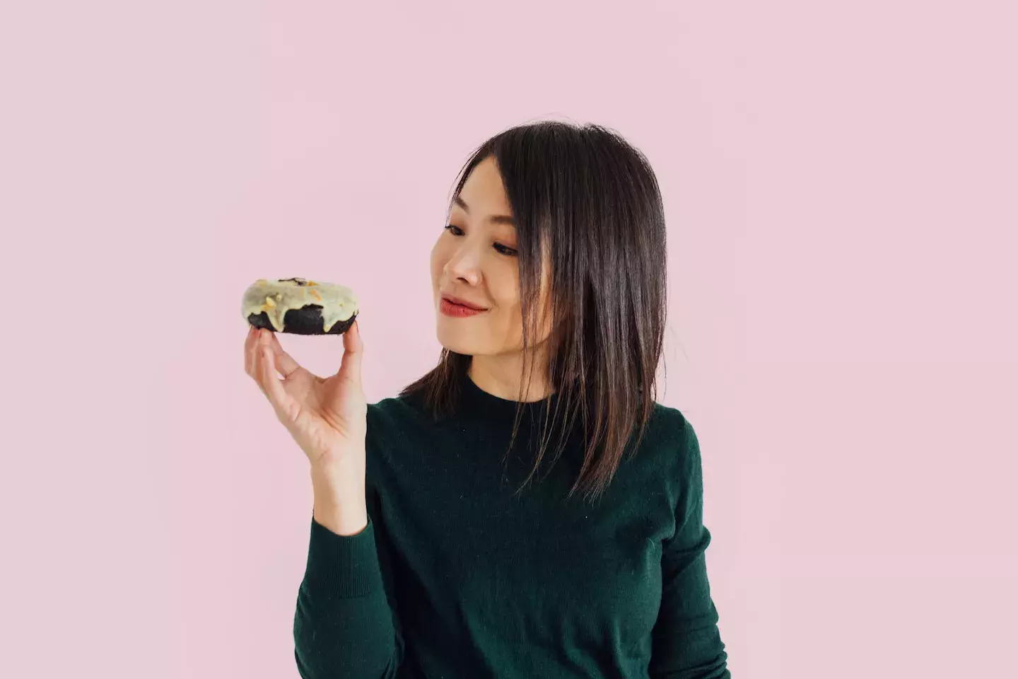 person looking at a slice of cake