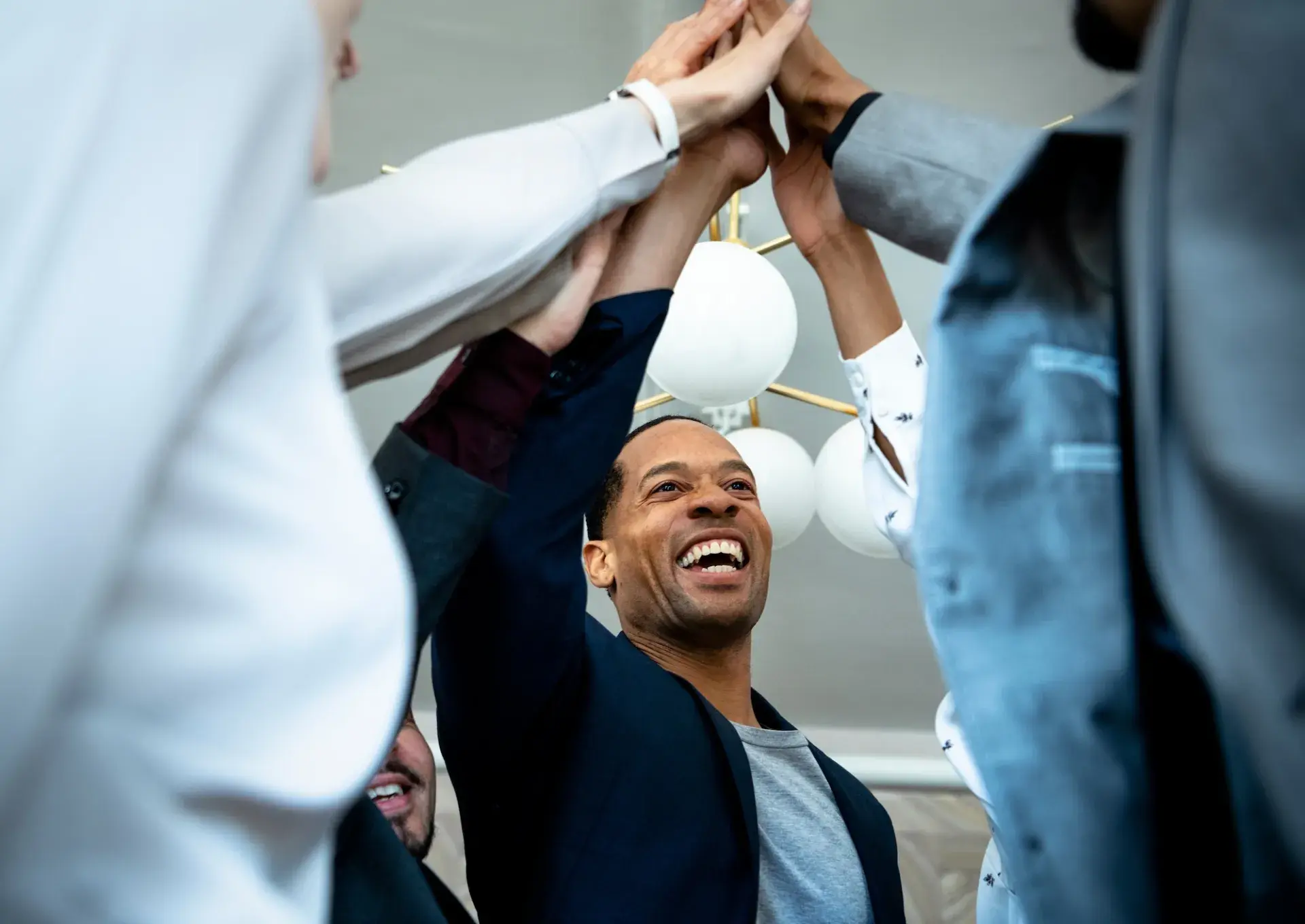 Business man high five coworkers