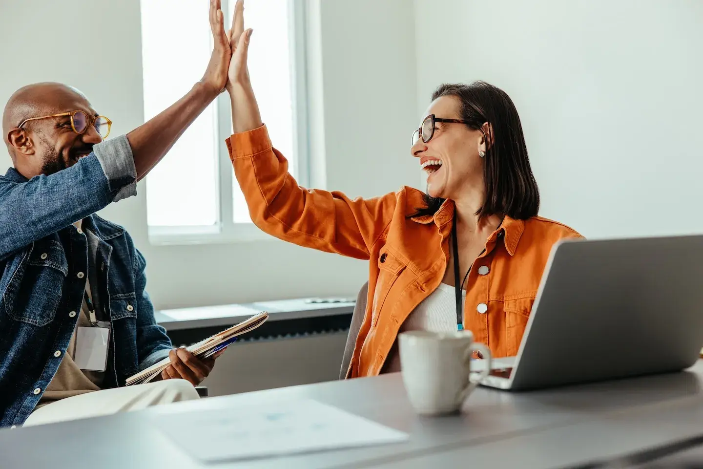 coworkers giving a high five