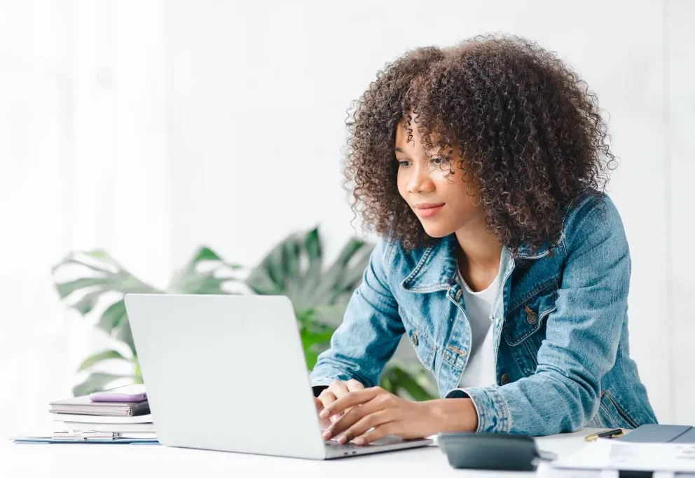 Young African woman with laptop