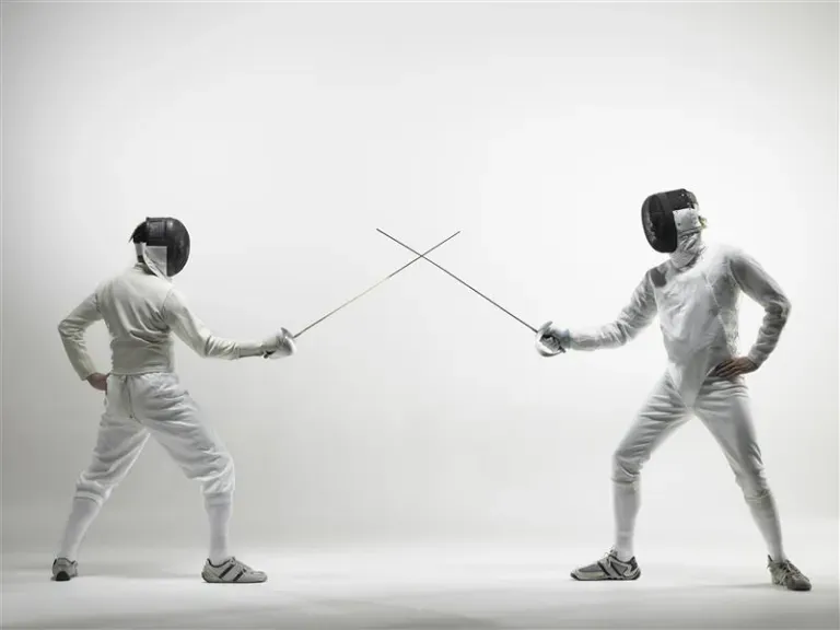 Two people fencing