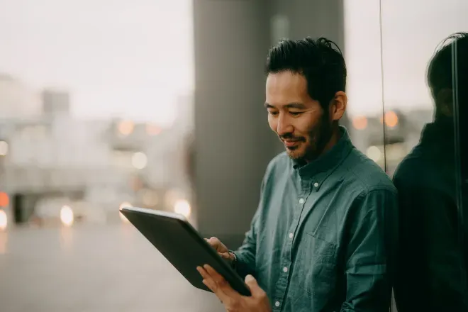 Man looking at tablet