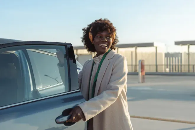 Woman opening car door