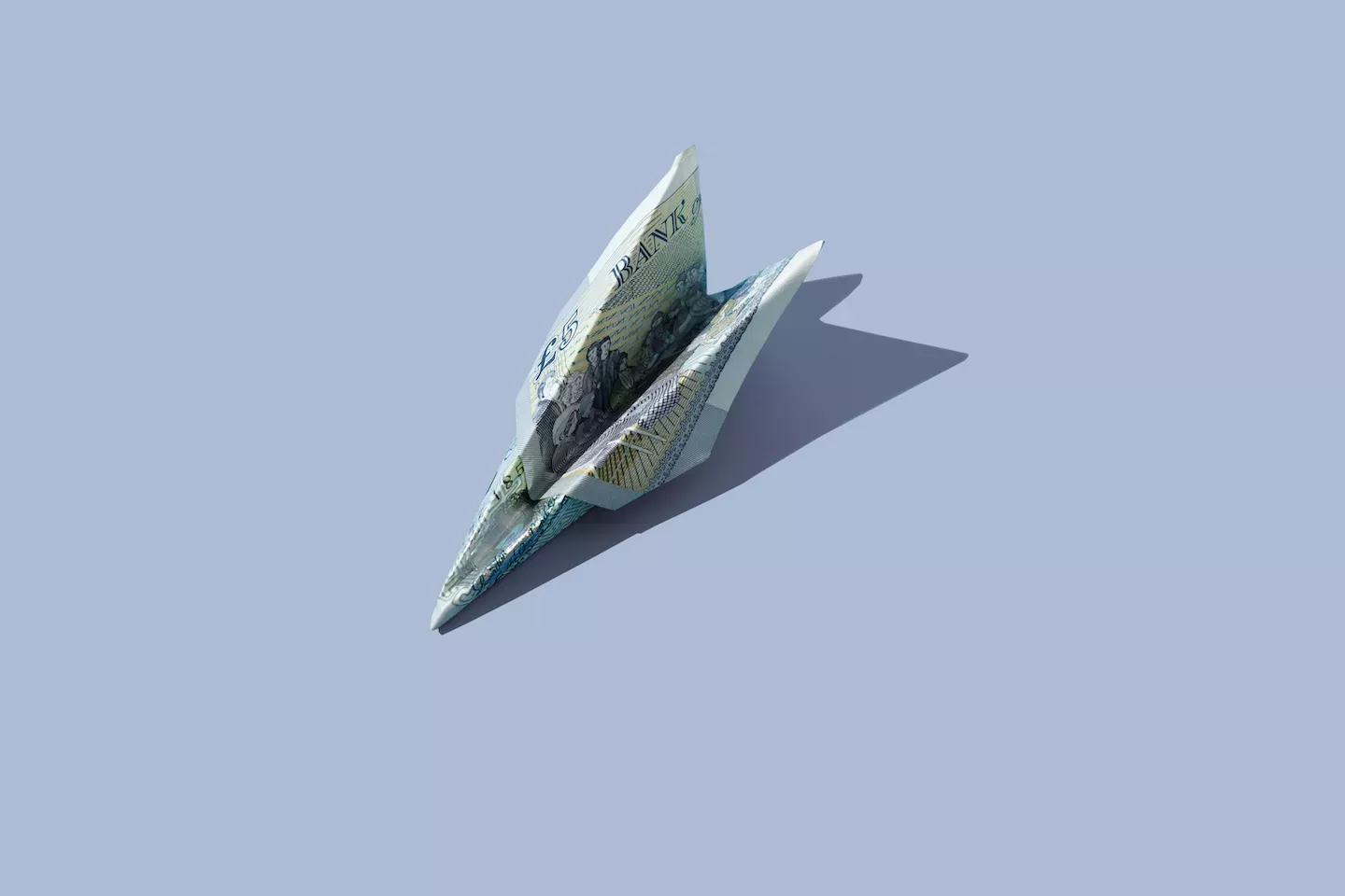 Avião de papel feito de dinheiro