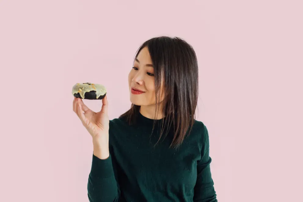 person looking at a slice of cake