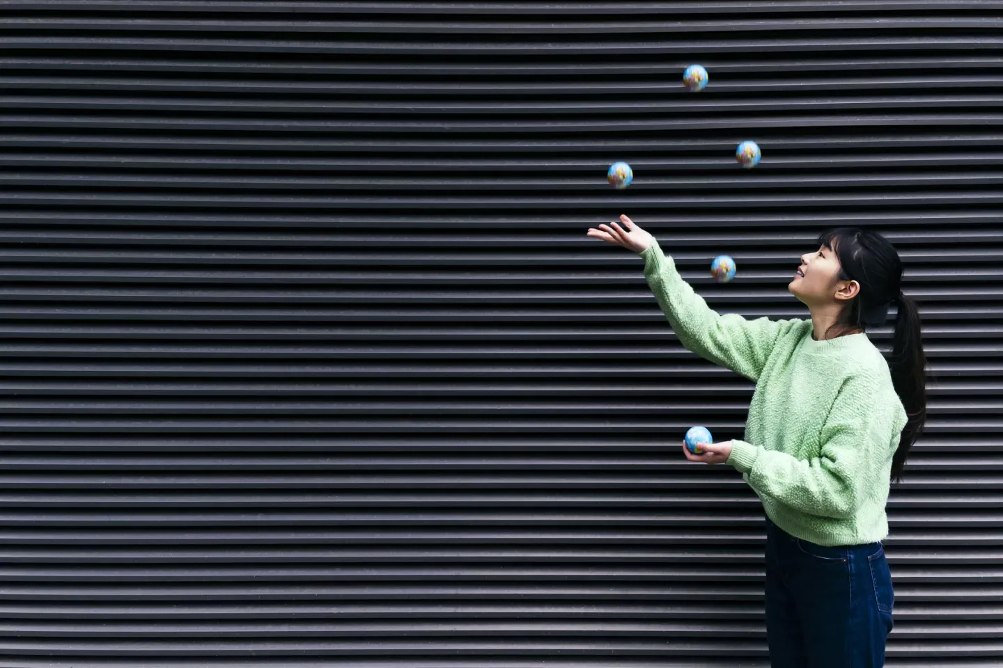 Woman juggling balls