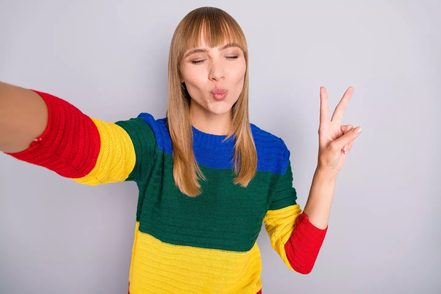 Woman giving a peace sign
