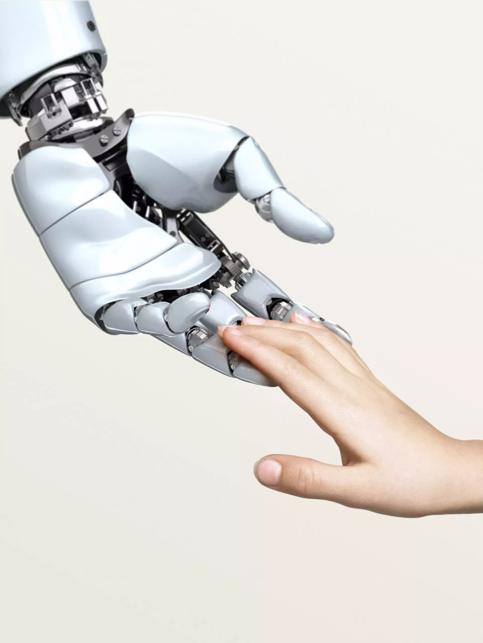 Artificial intelligence robot hand reaching out to human hand in caring way