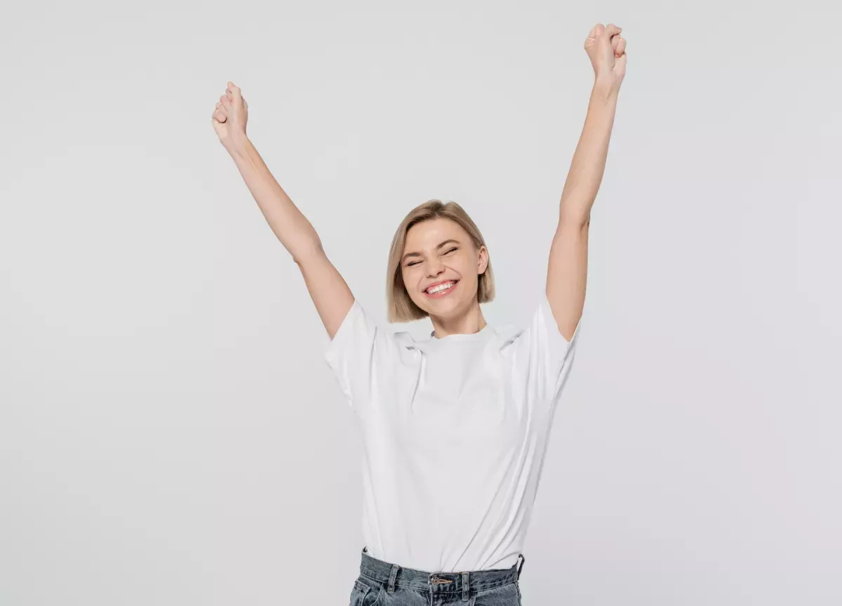Mujer celebrando el éxito Mujer celebrando el éxito