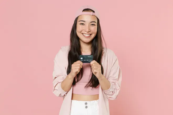 Woman holding a credit card