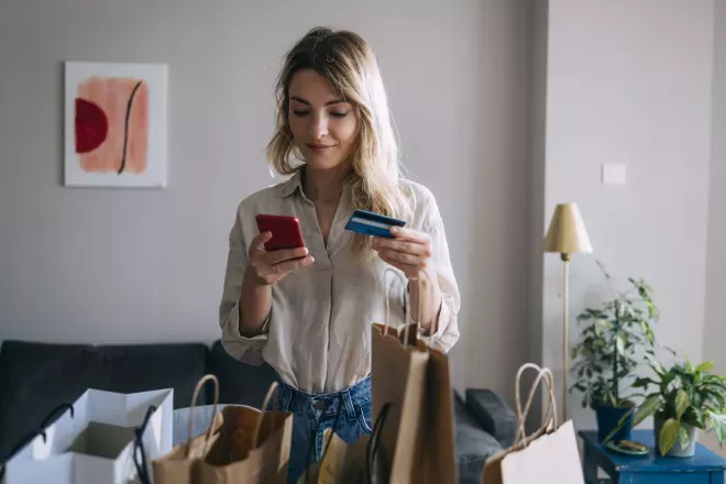 Woman purchasing something on her phone