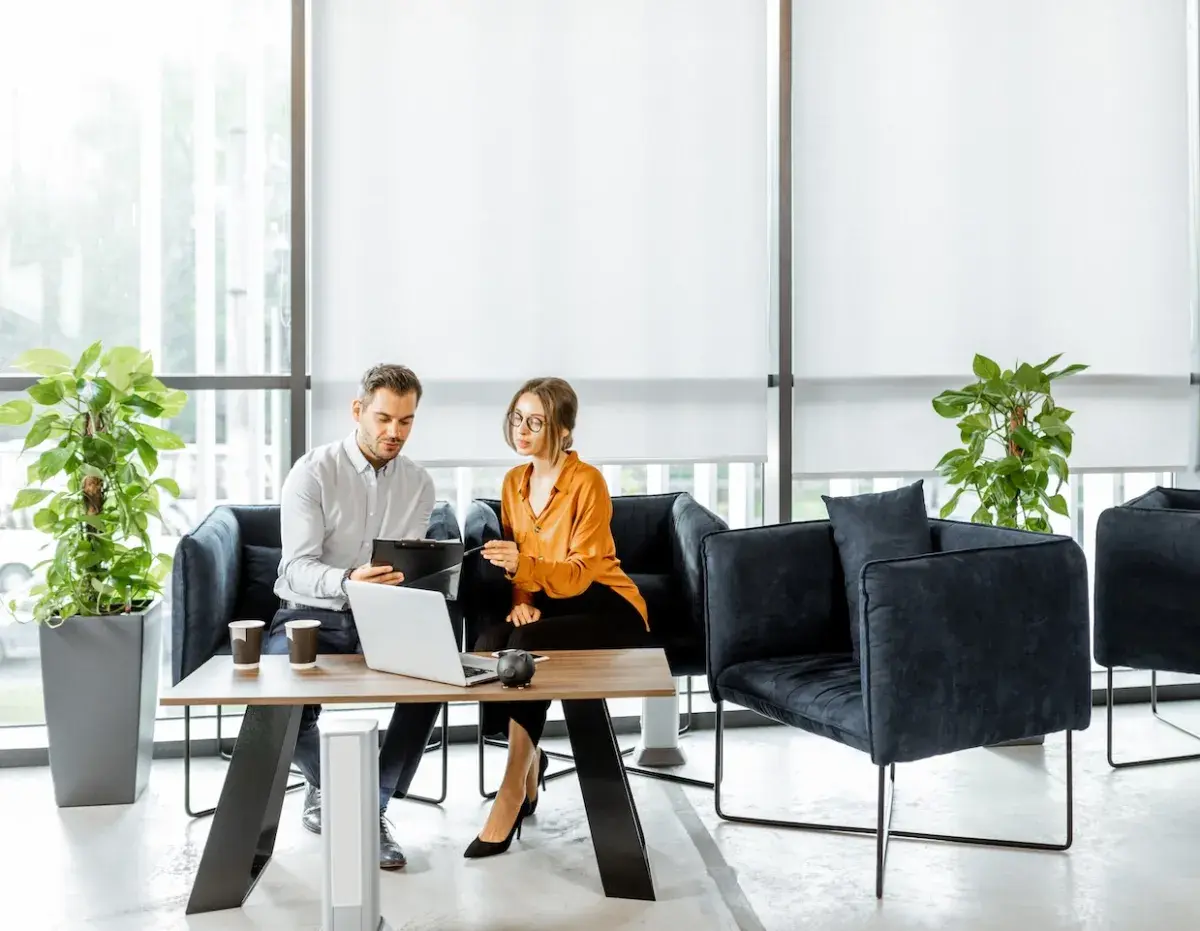 two people looking at computer