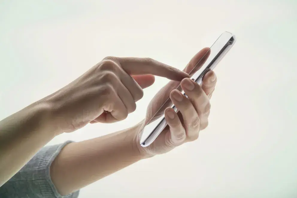 close up of person using cell phone