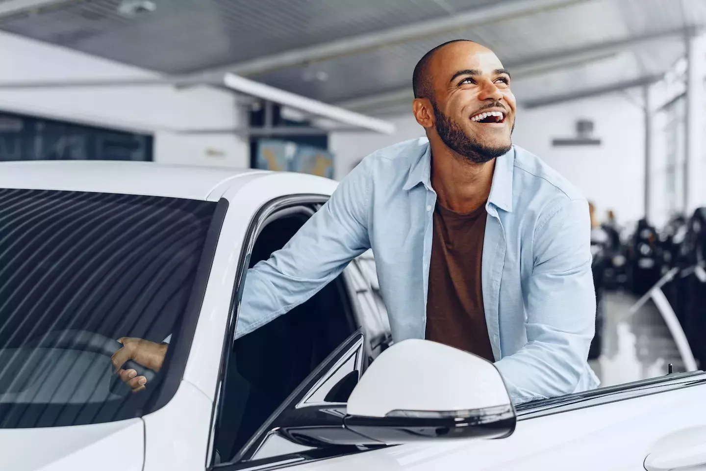 person getting into car