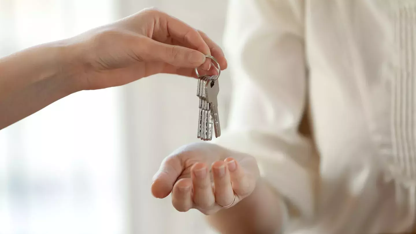 person holding keys