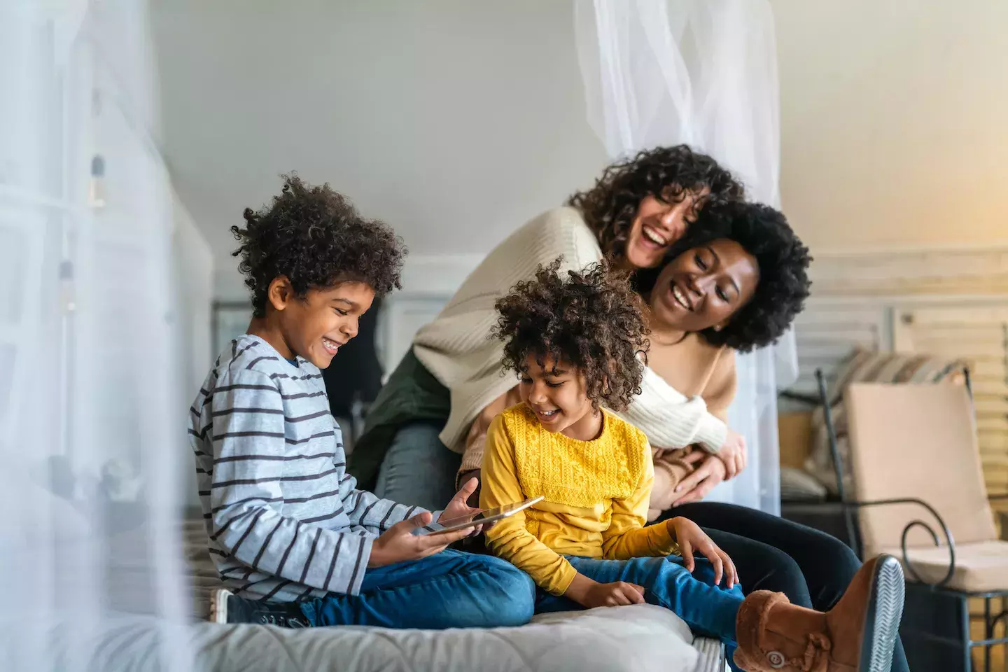 family at home on tablet