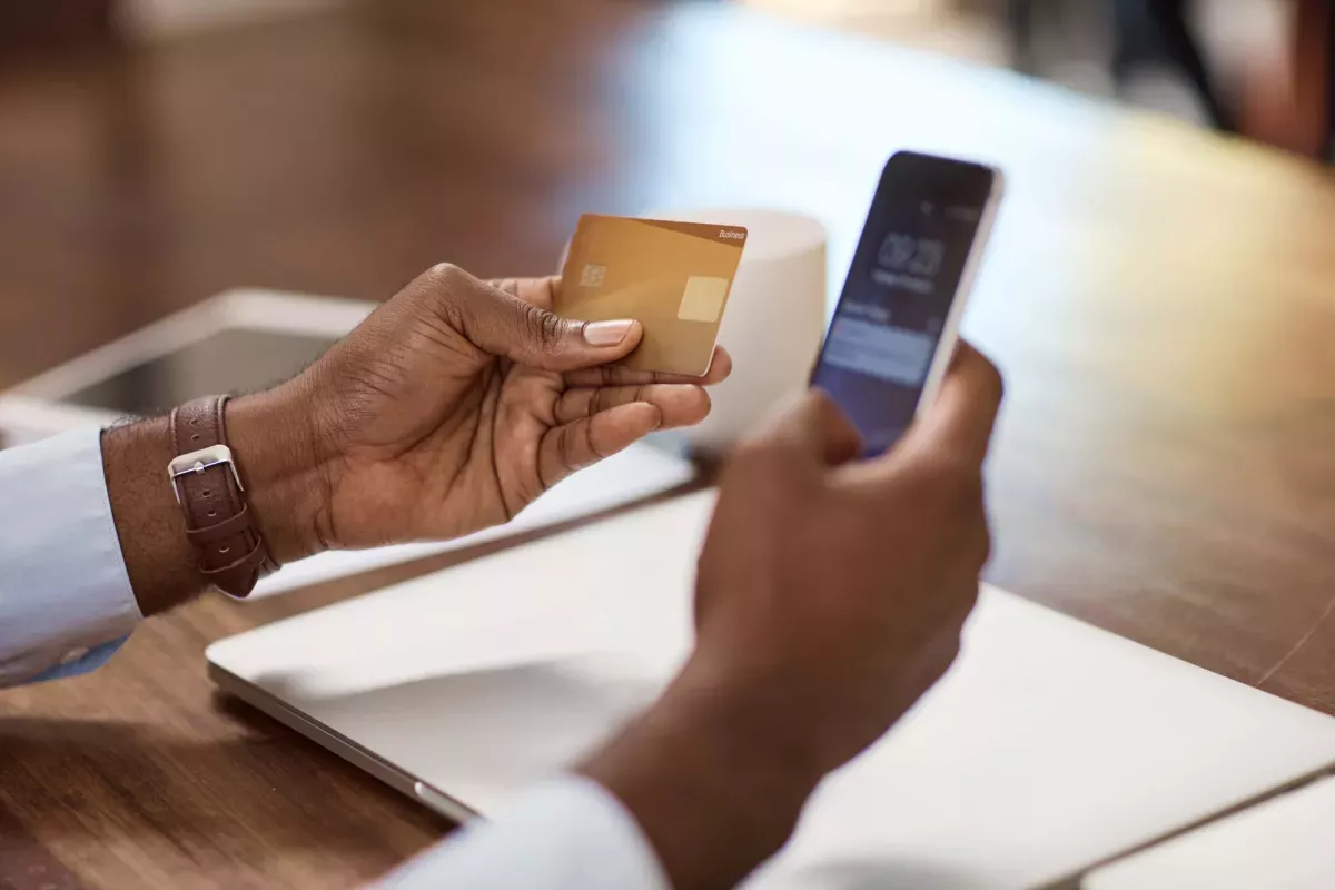 man-using-card.jpg Man paying online