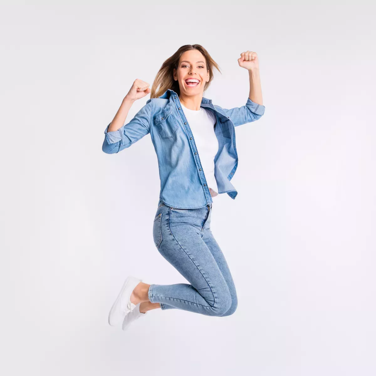 AdobeStock_281791581 copy.jpg woman leaping with joy