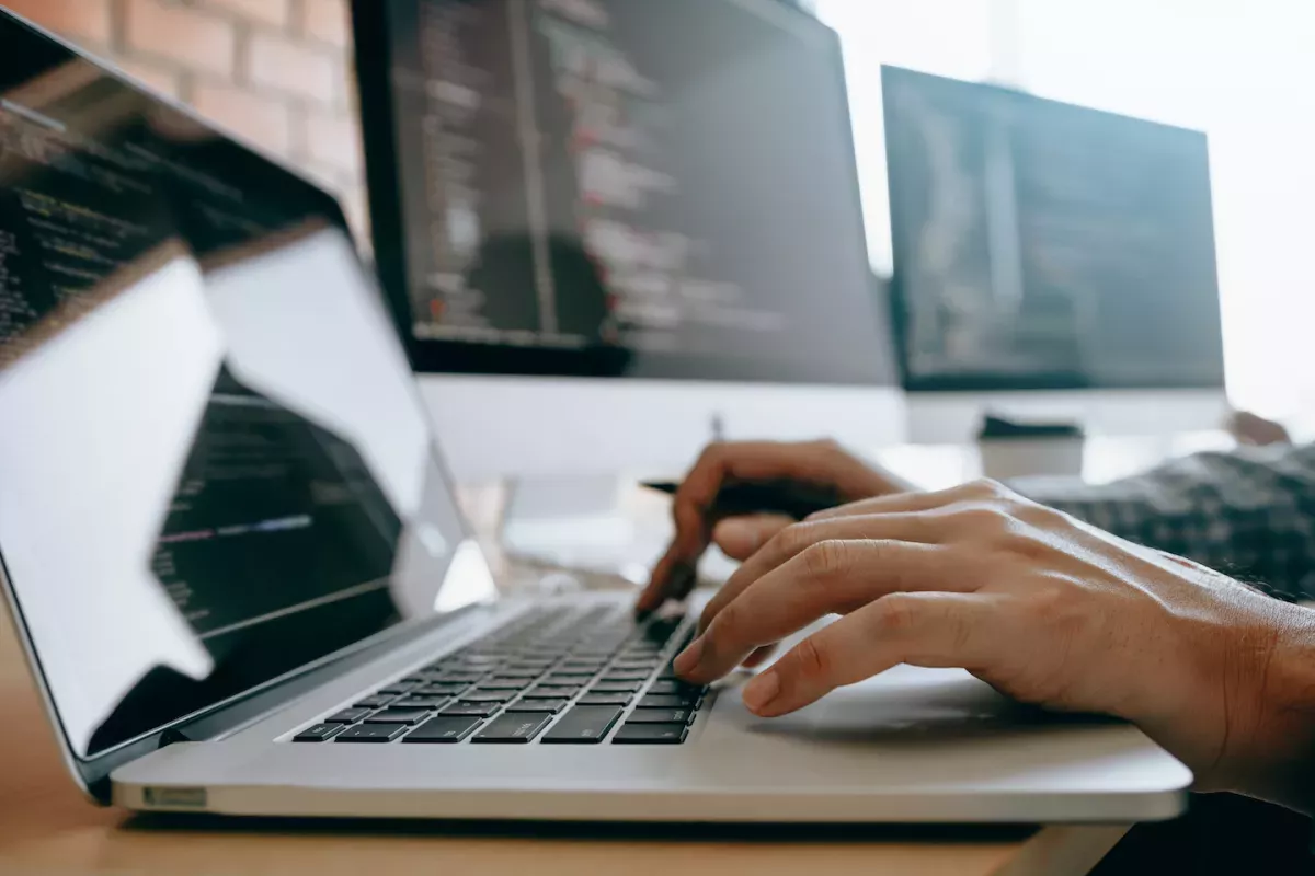 AdobeStock_283440262.jpeg Person typing on a laptop computer