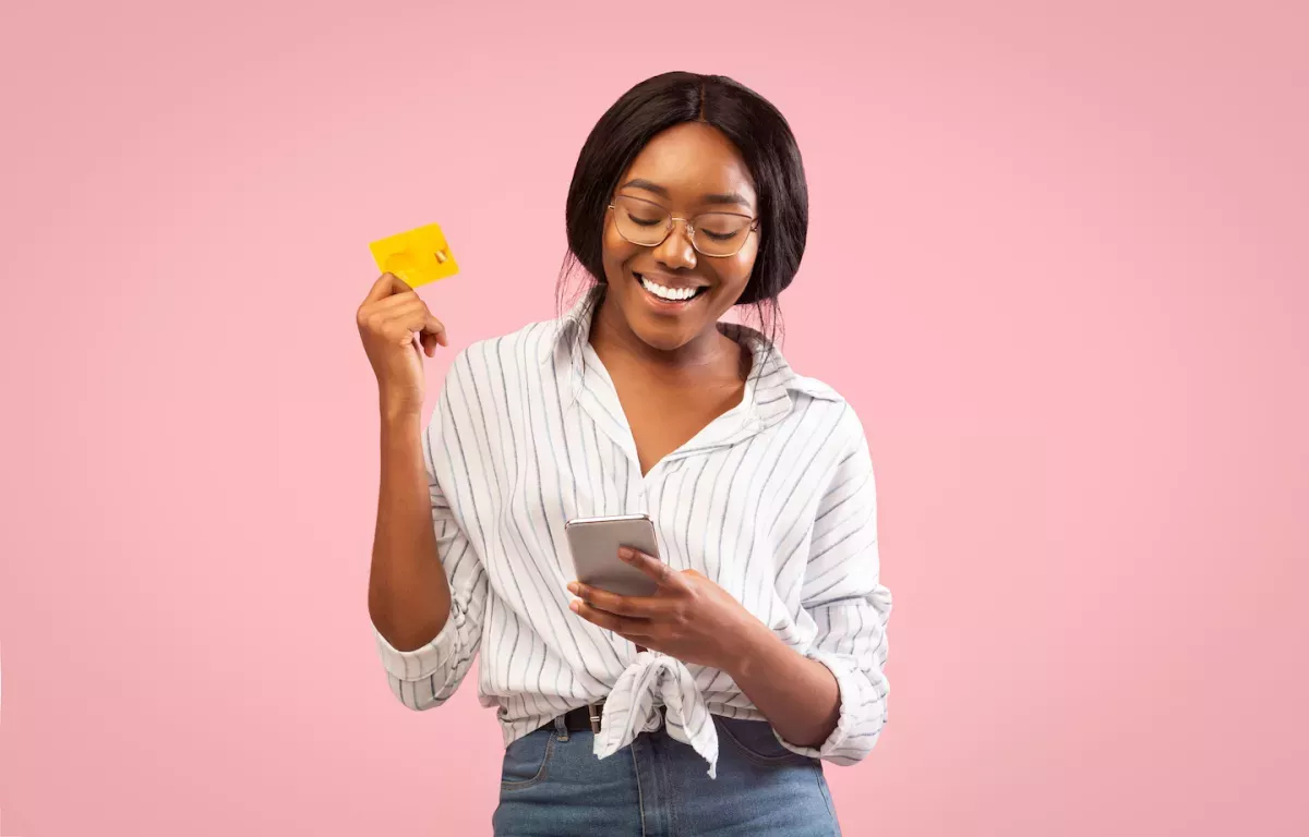 AdobeStock_299927318 (1).jpeg Woman using mobile banking app on cell phone