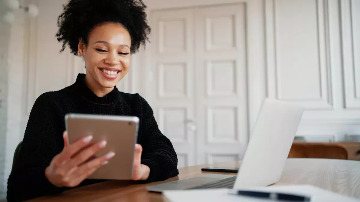 AdobeStock_430873330.jpeg Woman banking online