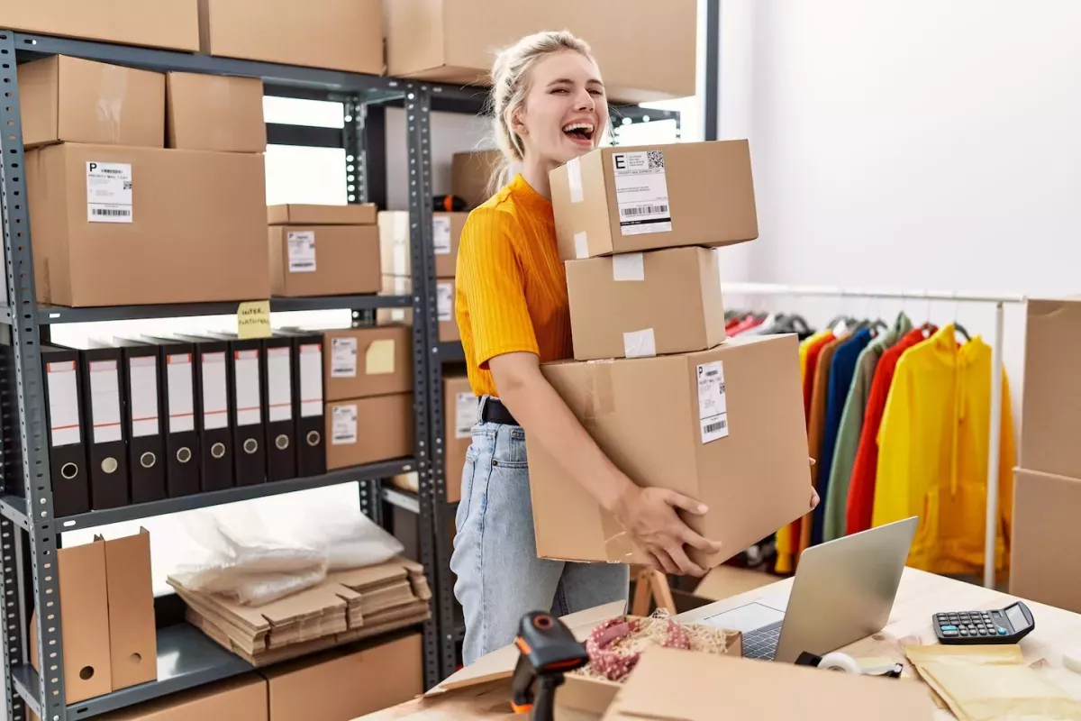AdobeStock_463404305.jpeg Woman shipping boxes