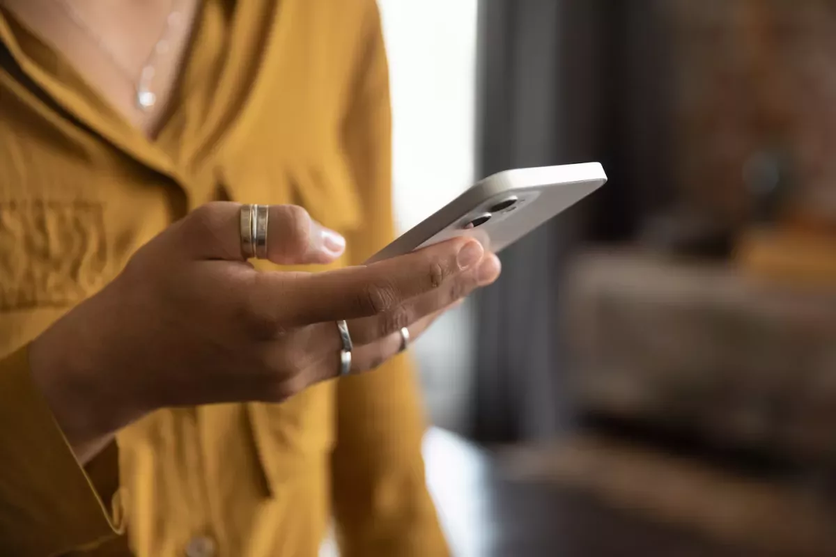 AdobeStock_475859257.jpeg Woman holding a phone