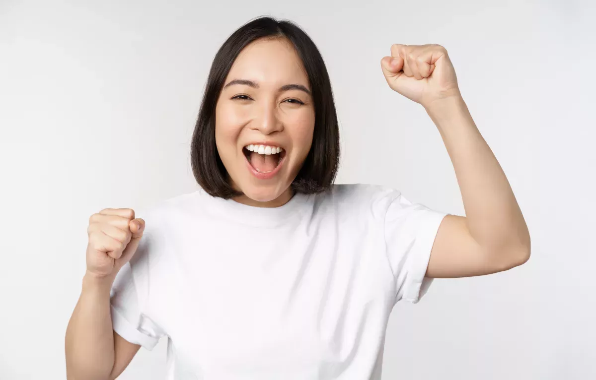 AdobeStock_492680021.jpeg woman exclaiming with happiness