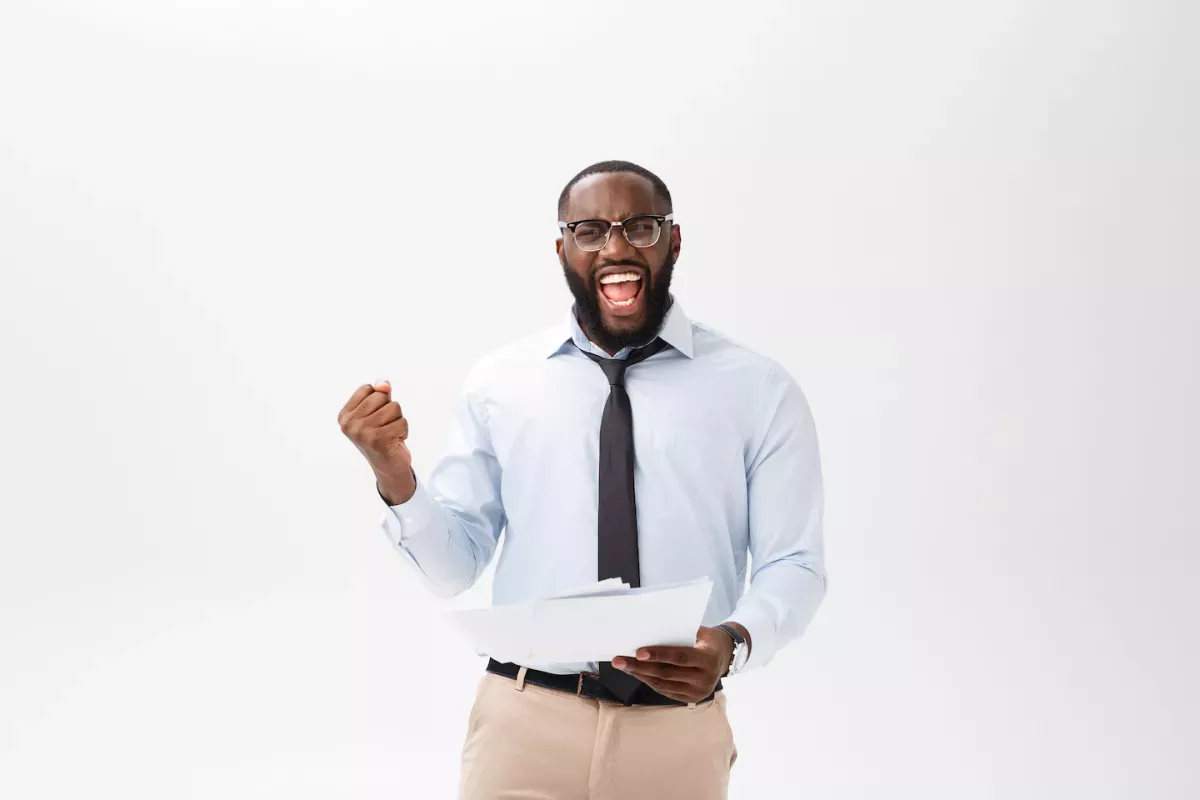 Super happy business man smiling with papers