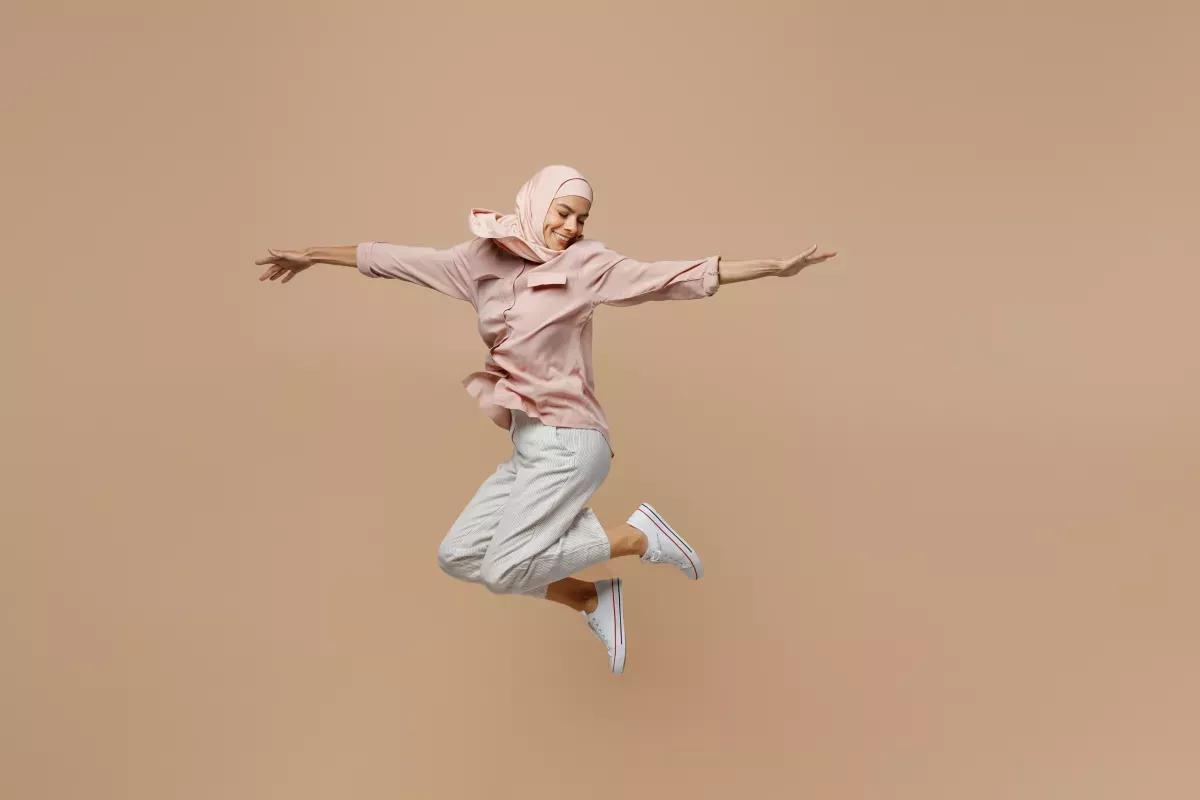 AdobeStock_518246800.jpeg woman leaping with joy