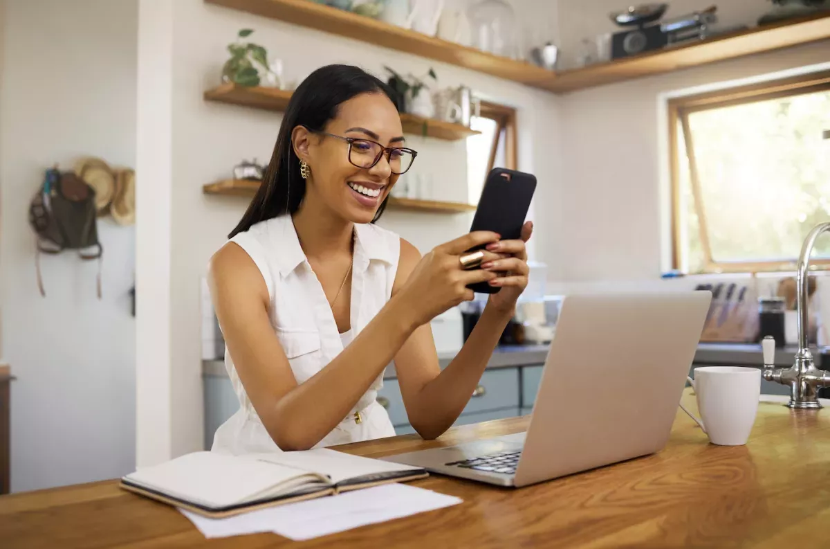 AdobeStock_537713657.jpeg Happy woman using a phone