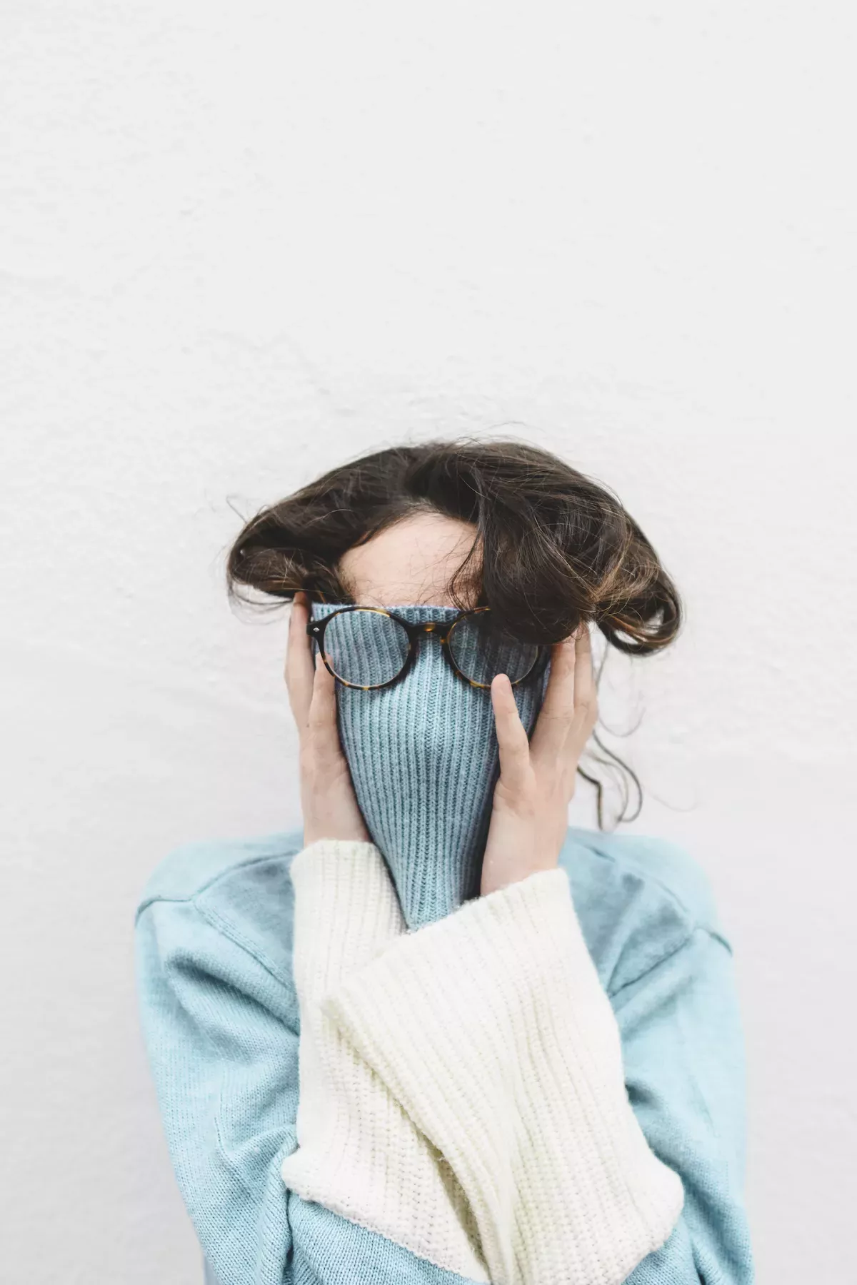 GettyImages-1223852504.jpg Woman hiding in her sweater