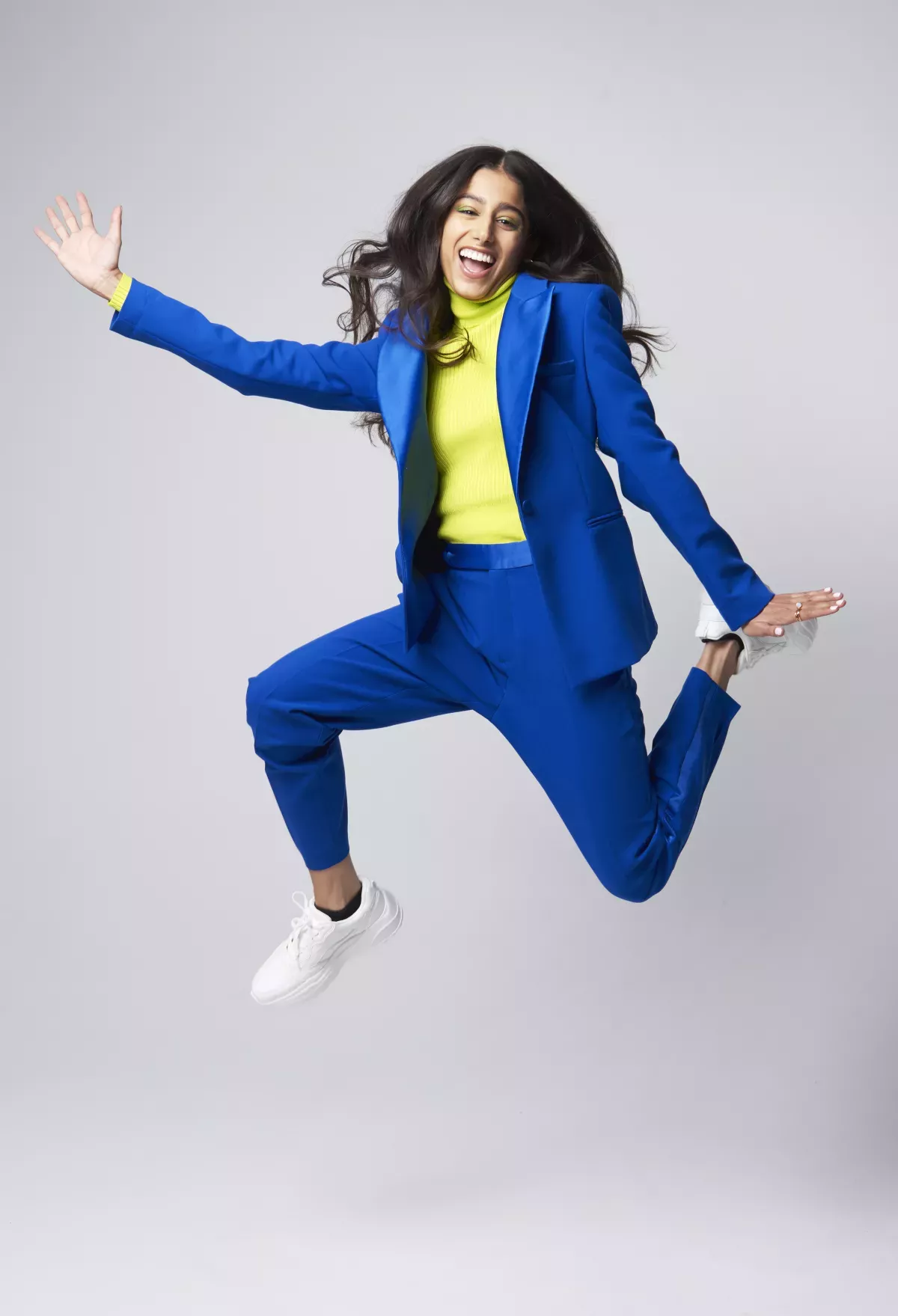 GettyImages-1355078965.jpg woman leaping with joy