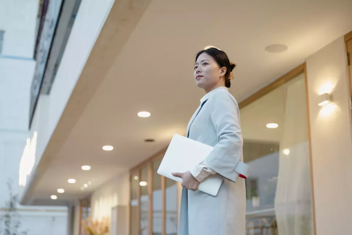 GettyImages-1388737415.jpg Woman holding a laptop