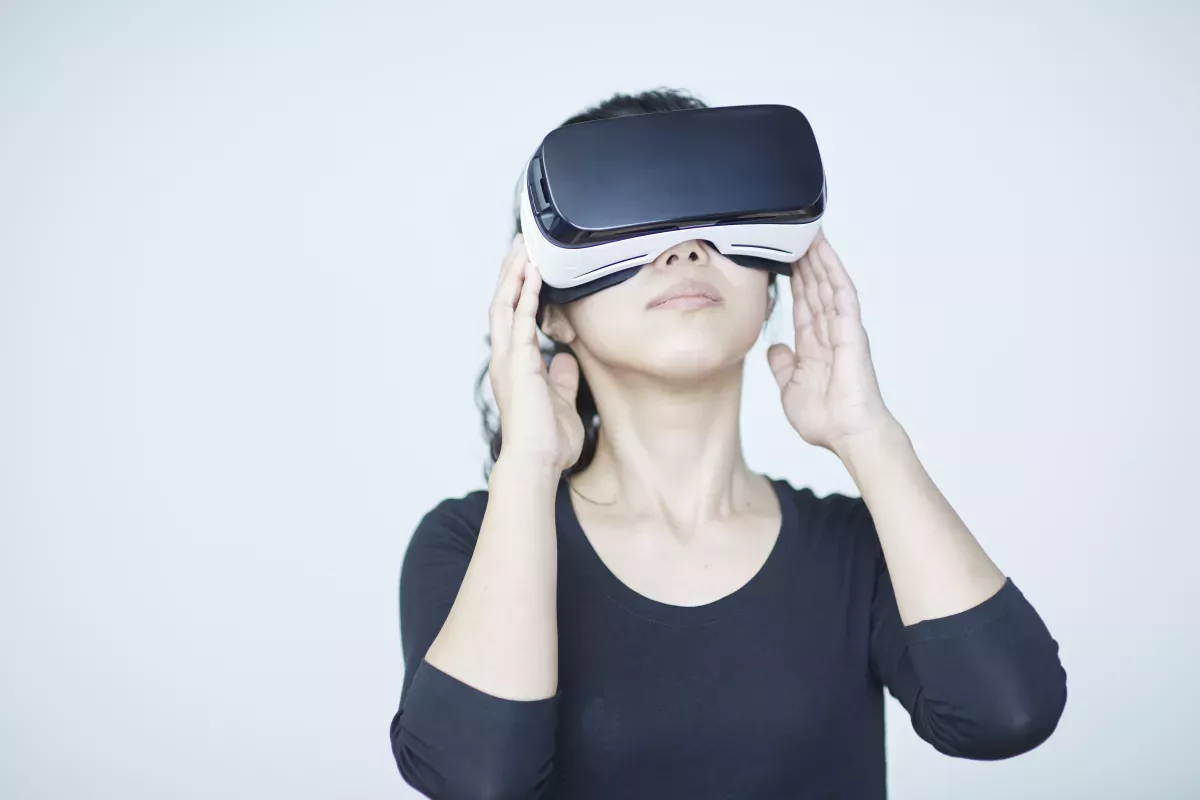 GettyImages-668541450.jpg person using virtual reality headset