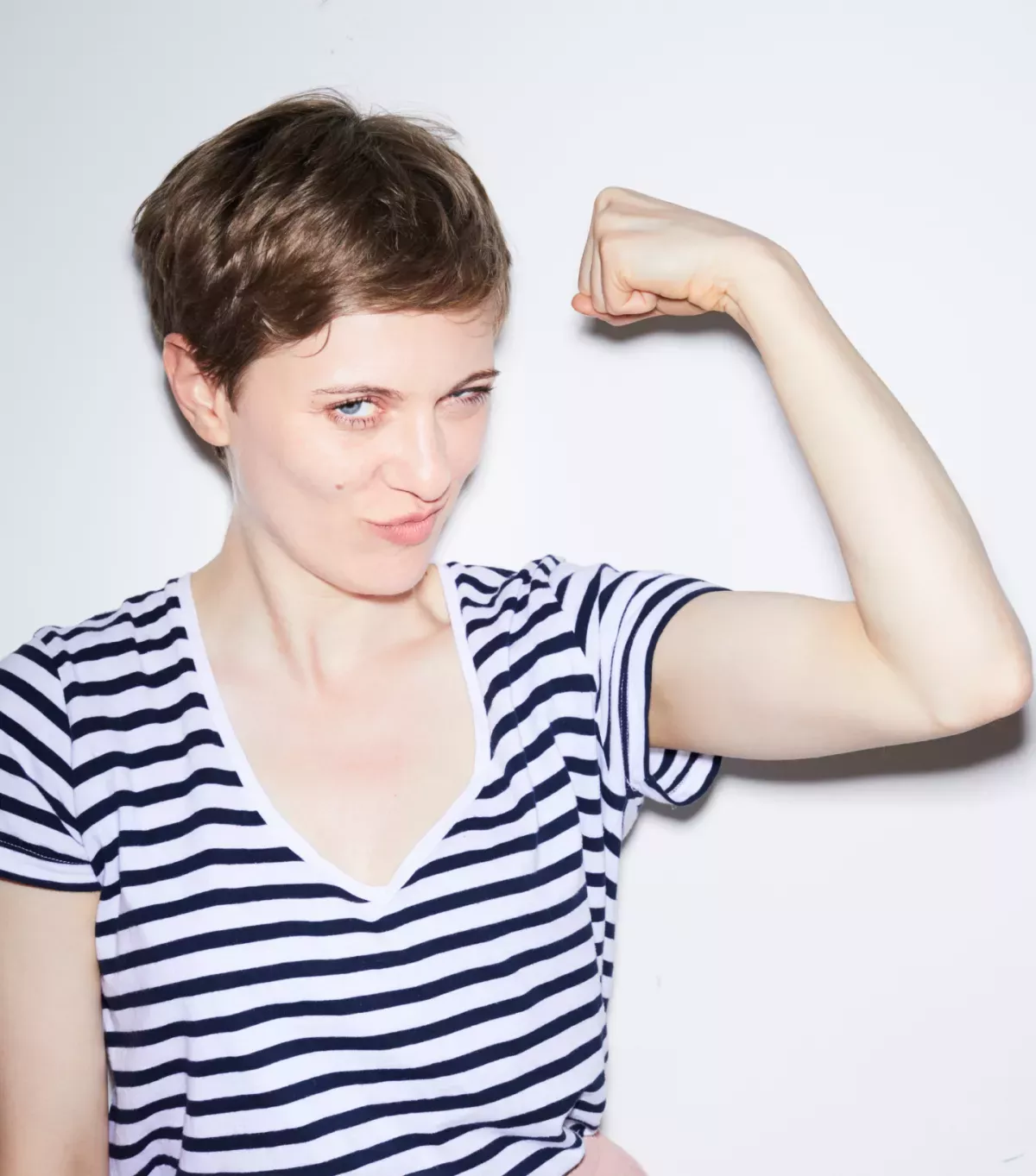 Governance.png Woman flexing her muscles