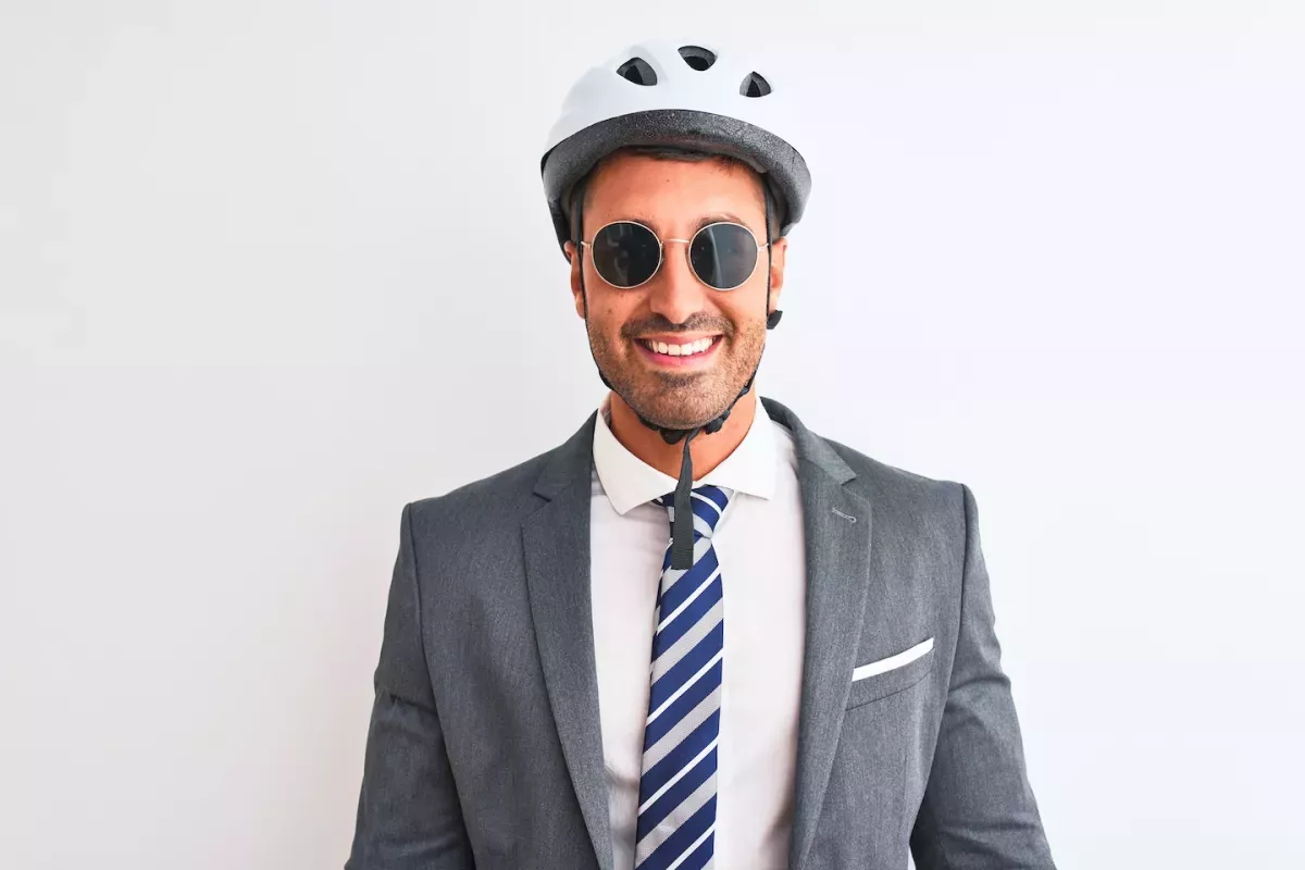 Insurance.jpeg Man in a suit wearing a helmet