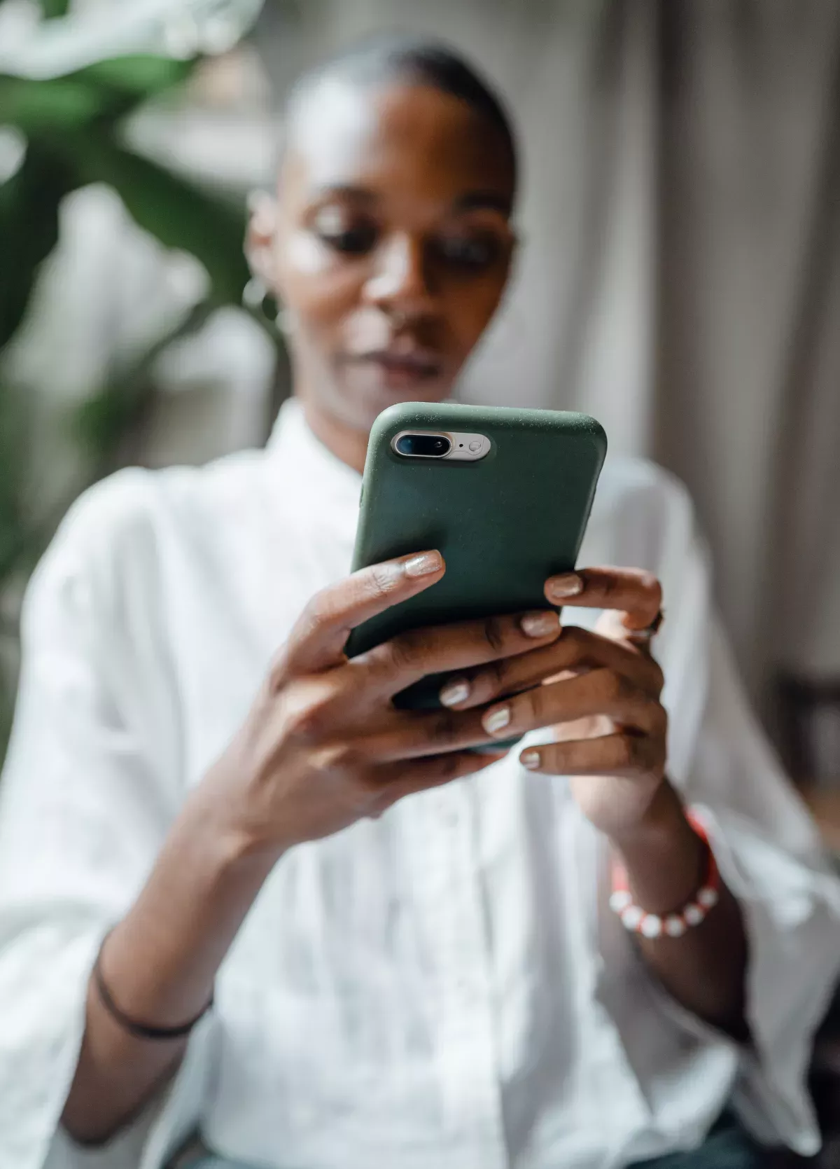 pexels-ketut-subiyanto-4350099_FICO Customer Communications Services close up of woman using cell phone