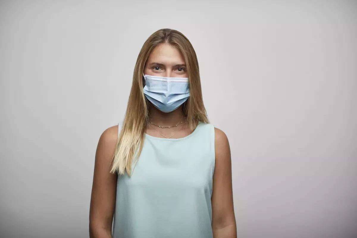 GettyImages-1274658478.jpg Woman wearing a mask