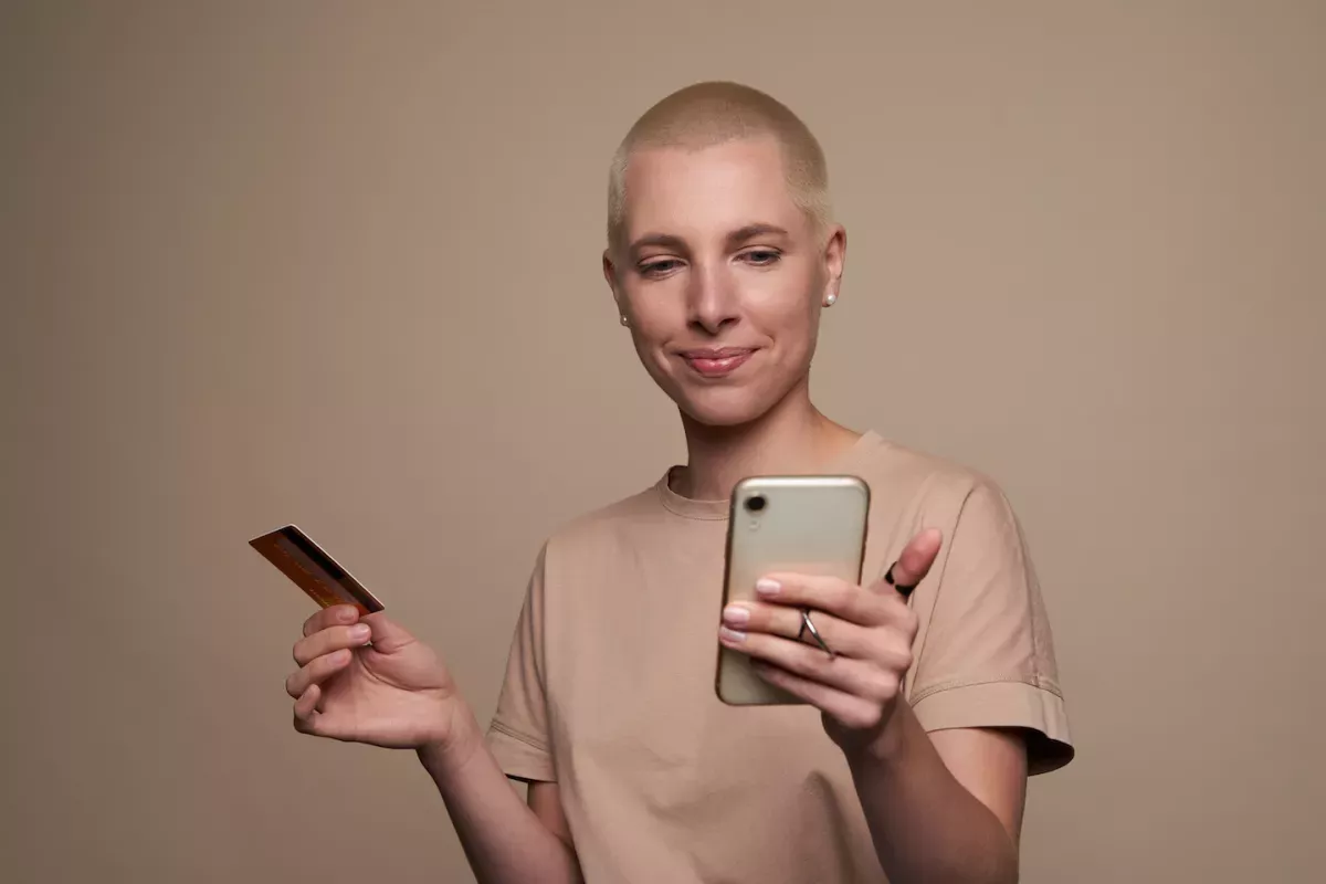 GettyImages-1340938196.jpg Person banking on mobile phone