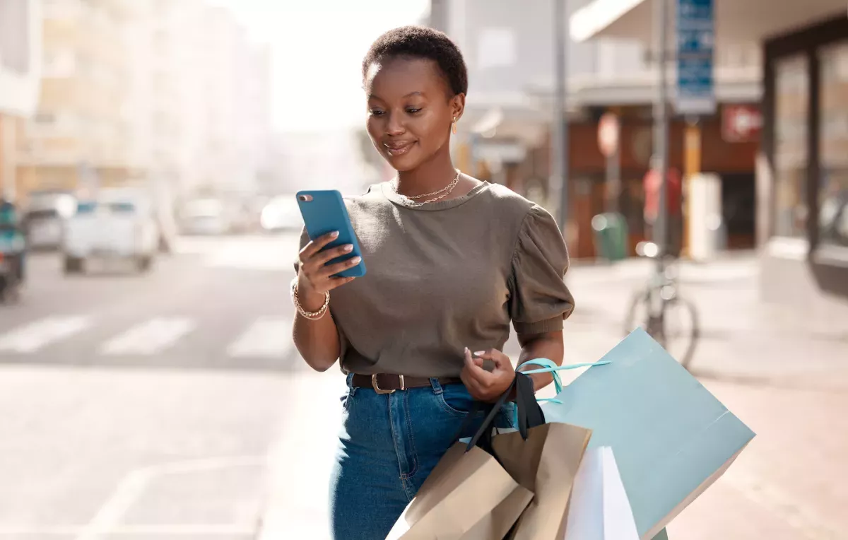 Woman shopping and checking her phone