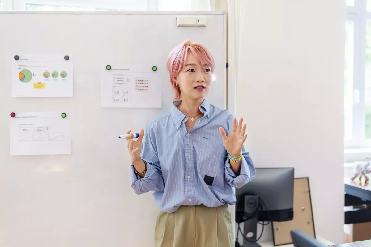 GettyImages-1437209178.jpg Business woman presenting data