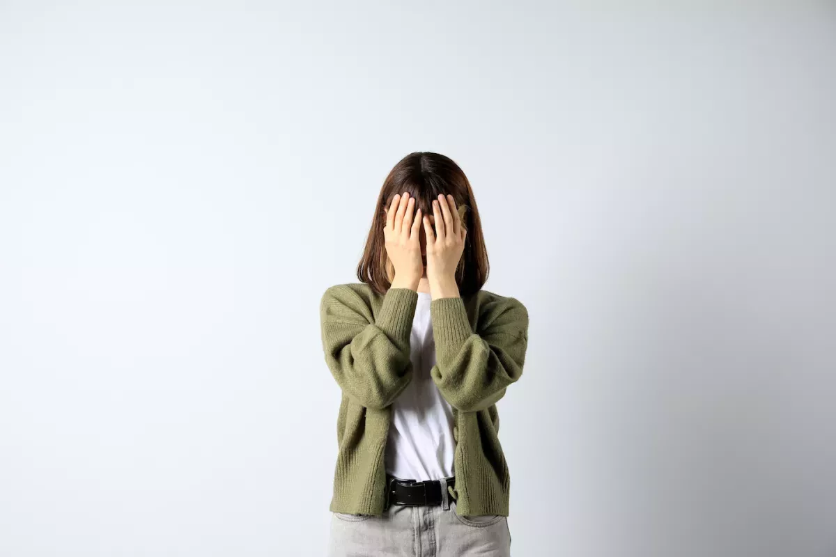 Person hiding their face
